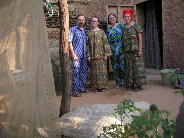 The family in front of Emilie's house